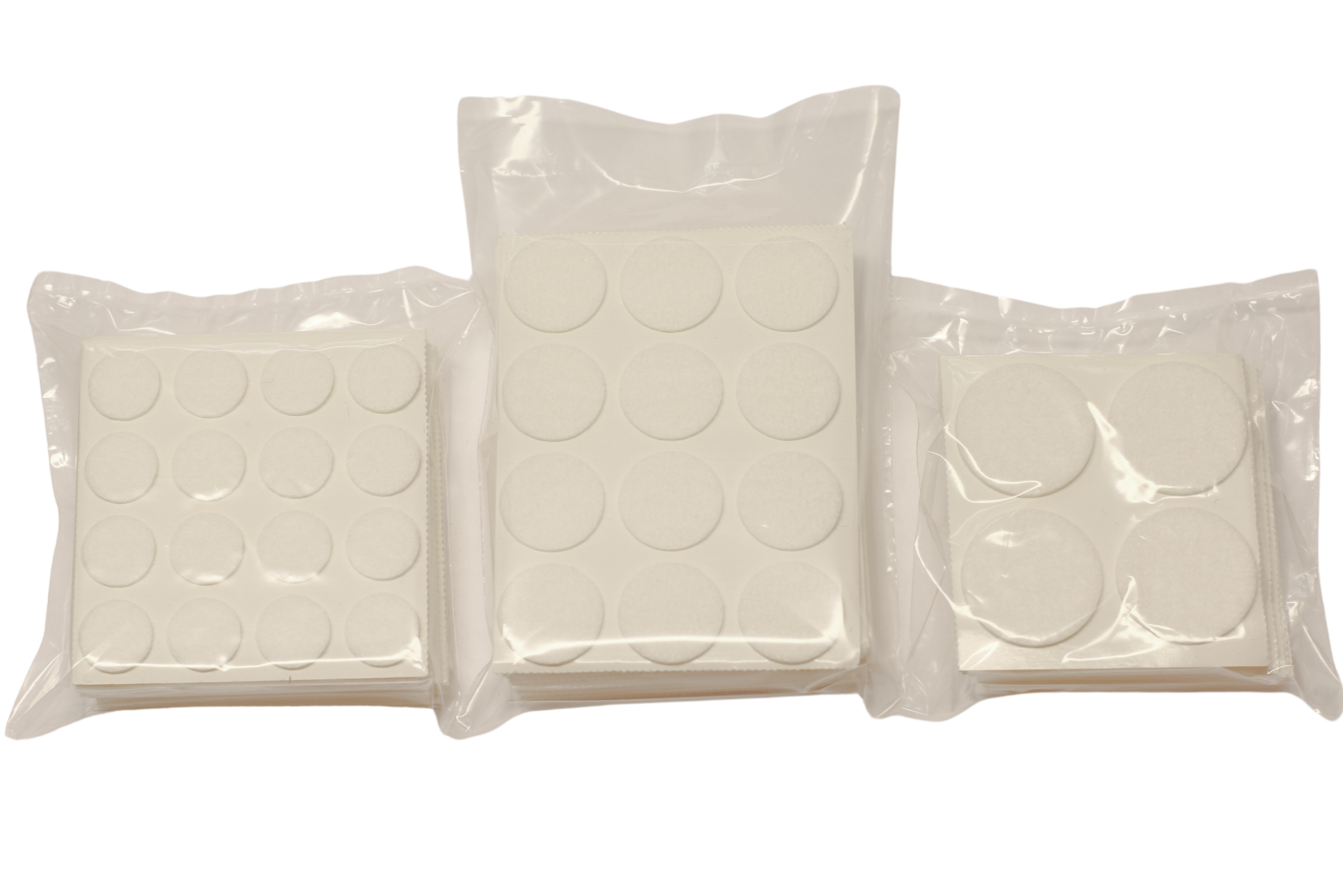 Självhäftande filtstorpack med runda filtbitar i olika storlekar.